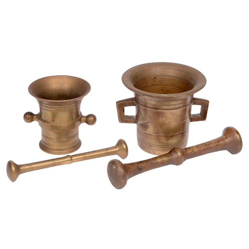 605 - A bronze pestle and mortar, 19th c, mortar 11.5cm and smaller brass example (4)