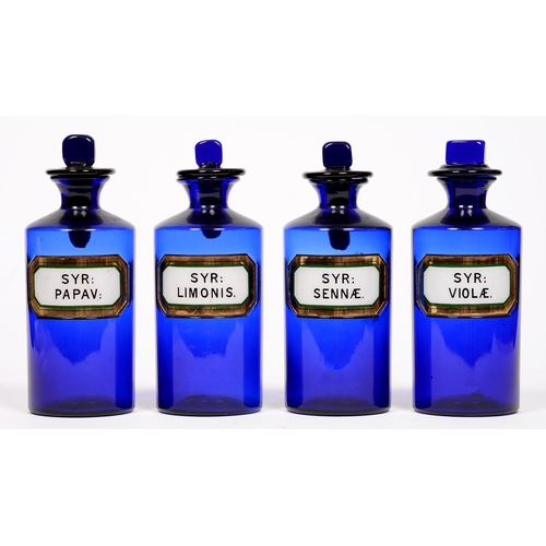 615 - Pharmaceutical Interest. Four blue glass chemist's bottles and stoppers, 20th c, Syr: Sennæ; Syr: Vi... 