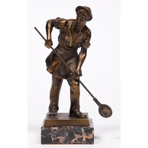 617 - A bronze statuette of a Foundryman, c1930, on Portor marble base, 23.5cm h