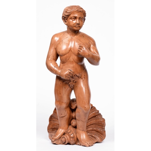 619 - A carved walnut figure of Poseidon, c.1900, standing before a shell, 62cm h