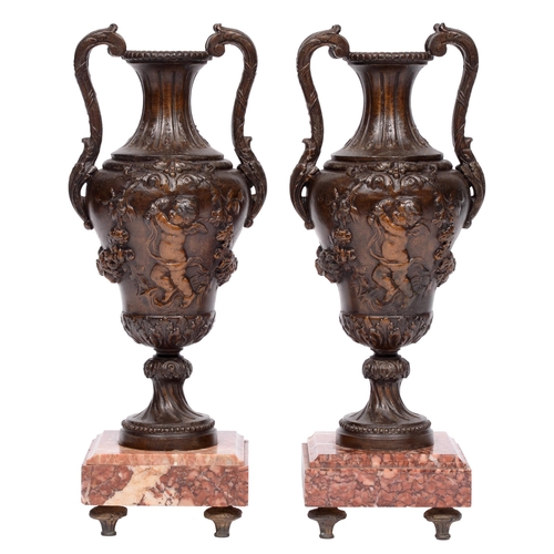 626 - A pair of French bronze patinated spelter vases, early 20th c, in Louis XVI style, square marble bas... 