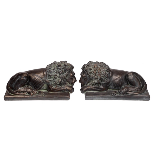 636 - A pair of bronzed resin Chatsworth lions, 20th c, 40cm l (2)