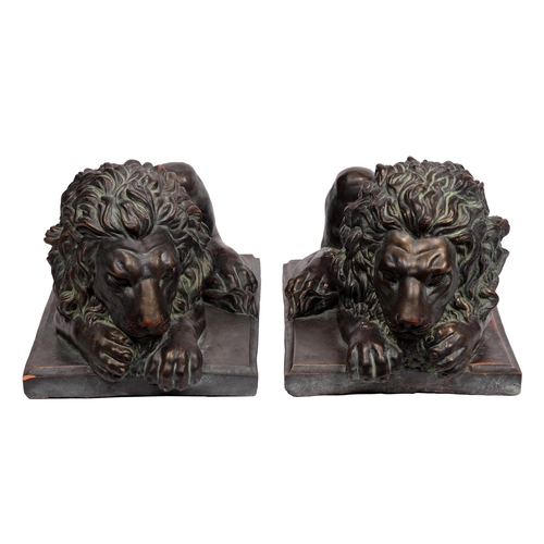 636 - A pair of bronzed resin Chatsworth lions, 20th c, 40cm l (2)