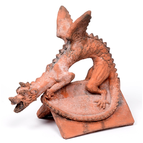 656 - A terracotta dragon roof tile, in the Chinese taste, 42.5cm h; 45cm w