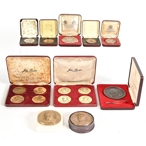 672 - Winston Churchill. A cased set of four silver gilt commemorative medals, with certificate, 45mm diam... 