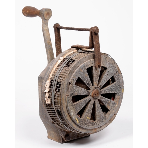 681 - Second World War. An aluminium air raid siren, n.d. [c.1939-45], softwood handle, the drum 23cm diam... 