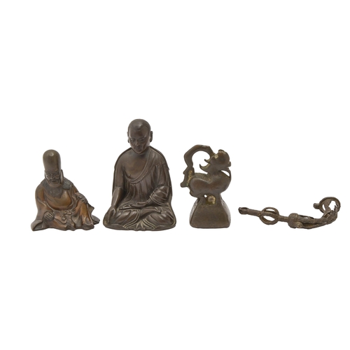 709 - A South East Asian bronze sculpture of a Kagyu hierarch, 19th c, 88mm h, a Chinese bronze figure of ... 