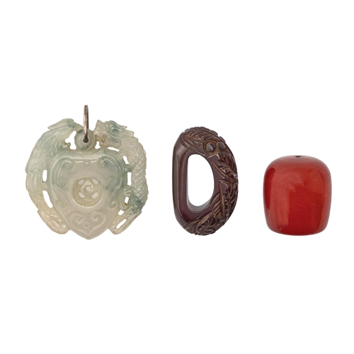 716 - A South East Asian carved and pierced jade pendant, 50mm h, a Faturan bead and a carved Faturan scar... 