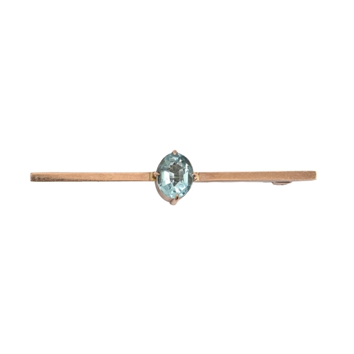 73 - A blue zircon bar brooch in gold, 58mm l, marked 9ct, 2.2g