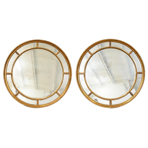 878 - A pair of antique-style giltwood and composition mirrors, 112cm diam