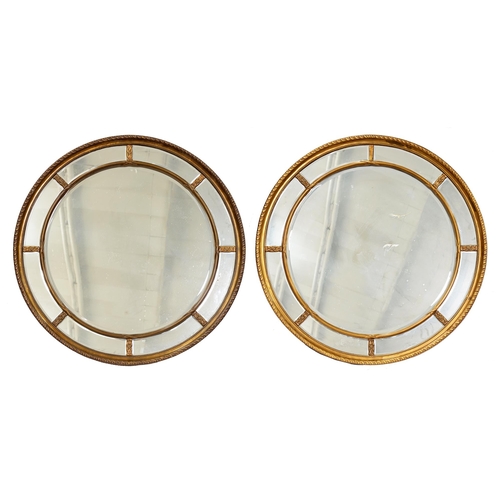 879 - A pair of antique-style giltwood and composition mirrors, 112cm diam