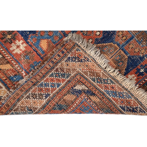 906 - A Persian Baluch rug, 102 x 102cm