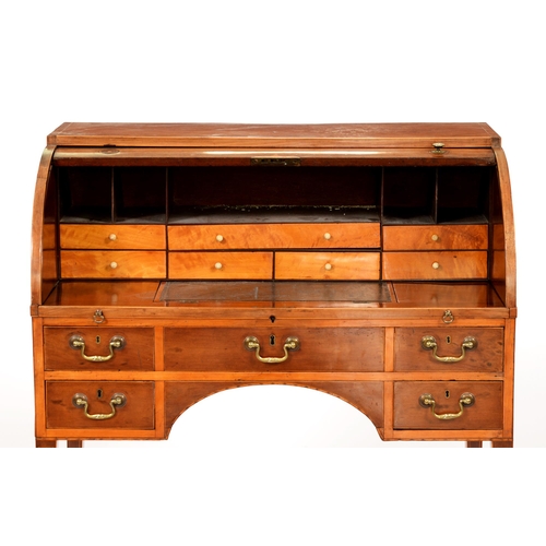 917 - A George IV mahogany cylinder bureau, cross-banded and line inlaid, having fitted interior, on squar... 