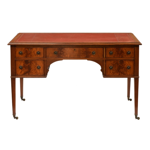 953 - A mahogany writing table, early 20th c, with red tooled leather top, on square tapering legs and bra... 