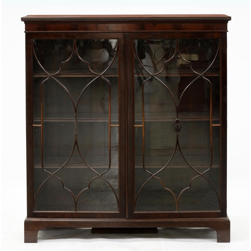 958 - A mahogany glazed bookcase, c1920, with moulded cornice, adjustable shelves, on bracket feet, 138cm ... 