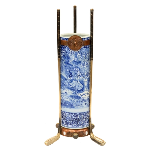 966 - Golfing interest. An unusual Edwardian brass and copper mounted Japanese blue and white stick stand,... 