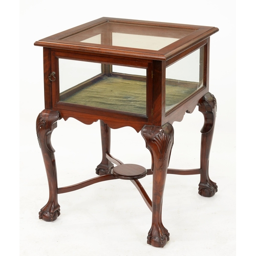 968 - A mahogany display table, c1930, on scrolling legs, claw and ball feet and x-stretcher base, 78cm x ... 