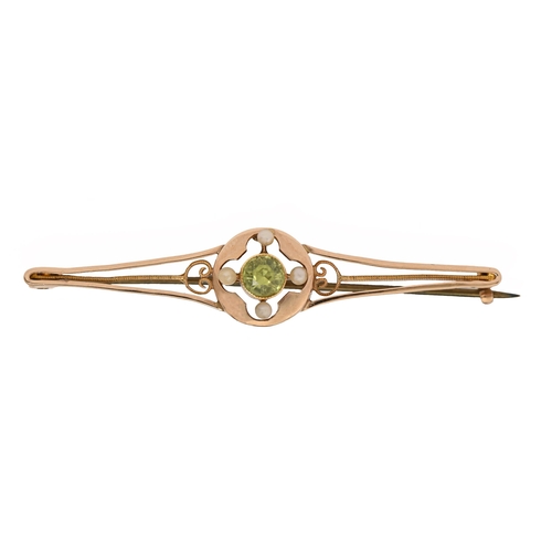 97 - A peridot and split pearl bar brooch, 50mm l, marked 15ct, 3g