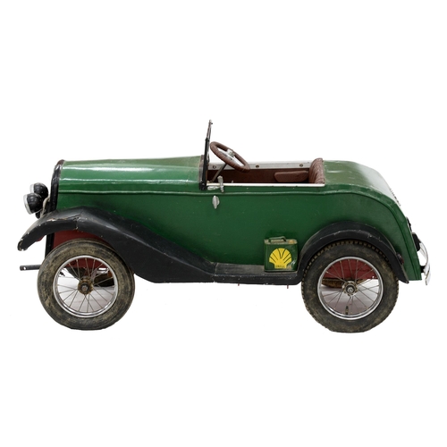 986 - A child's green and black painted aluminium, steel and wood motor car, second quarter 20th c, with p... 