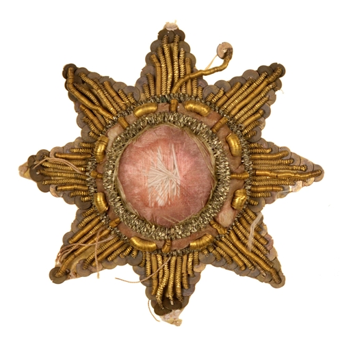 105 - Crimean War relic. A Russian officer's embroidered metal thread and cloth coat tail star ornament, a... 