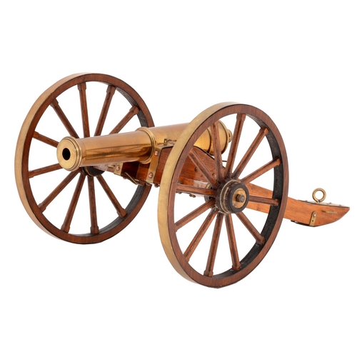 84 - A brass model of a 9lb field gun, 1854, 20th c, on walnut carriage with brass mounts, barrel 21cm l... 