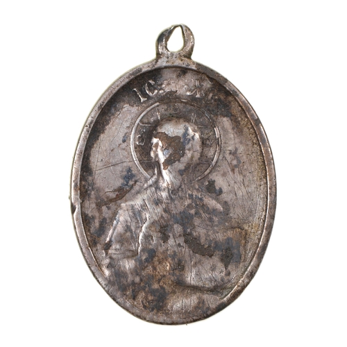 86 - A Russian silver pendant, obv. Christ Pantocrator, rev. Cyrillic inscription, 34mm overall... 