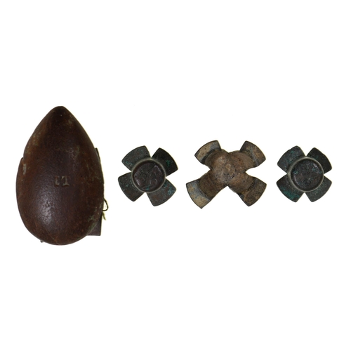 97 - Crimean War relics. Three Russian percussion caps and a bayonet lug believed to be from the Battle o... 