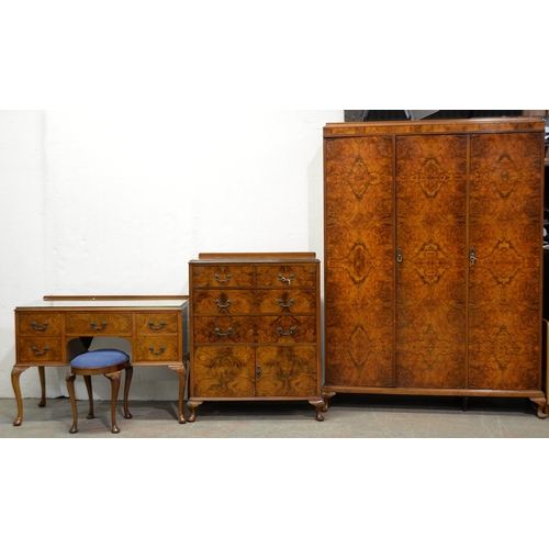 1035 - A walnut bedroom suite, c1930, in richly figured quarter veneers, on cabriole legs, comprising wardr... 