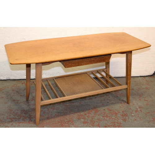 1036 - A mid century light oak coffee table, 1960s, with recessed drawer and slatted under tier, 45cm h; 42... 