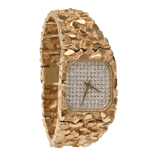 104 - A diamond wristwatch, with cushion-shaped pavé set numberless dial, the tapering semi-textured brace... 