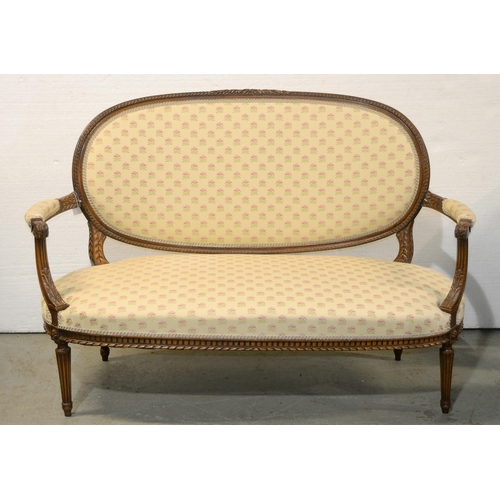 1040 - A French walnut canape, early 20th c, in Louis XVI style, 144cm l