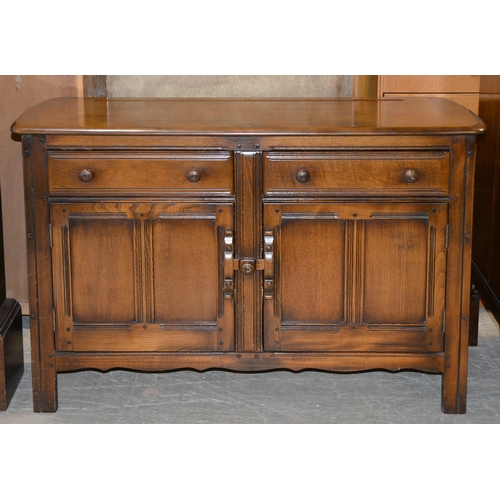 1044 - An Ercol stained ash sideboard, 122cm l