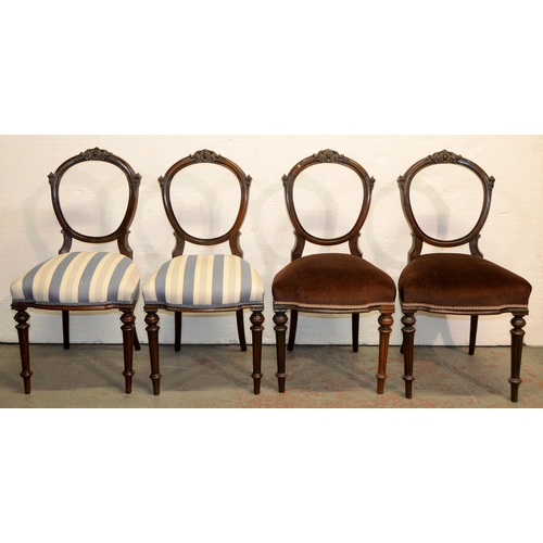 1057 - A set of four Victorian walnut dining chairs