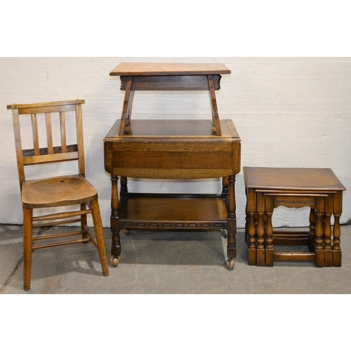 1067 - An oak nest of tables, an oak coffee table with trestle ends, an oak drop leaf tea trolley and a Vic... 