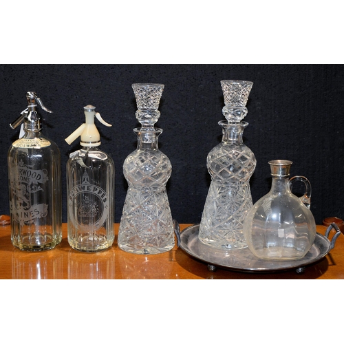 1099 - A silver mounted glass carafe, a pair of thistle shaped cut glass decanters and stoppers and an EPNS... 