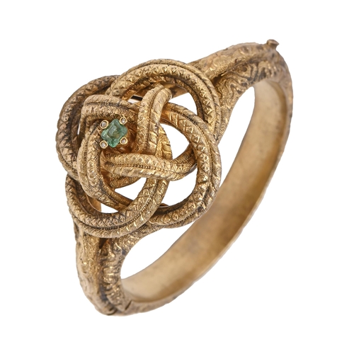 110 - An emerald and diamond knot bangle, late 19th c, in gold coloured metal, 54mm (internal), 28.5g... 