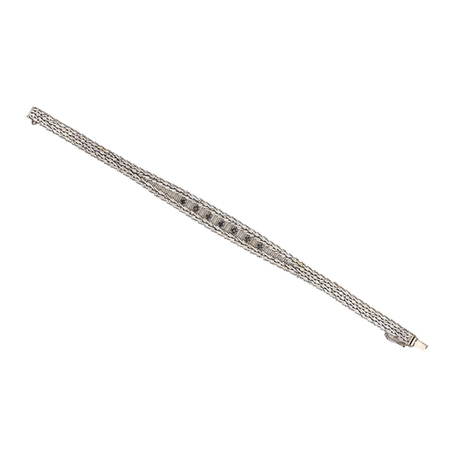 111 - A sapphire bracelet, in white gold, 19.5cm l, marked 750, 18.6g