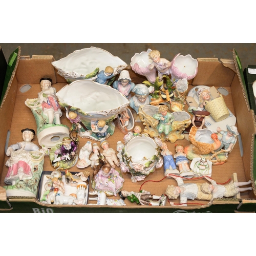 1123 - A collection of Continental biscuit and other porcelain figures of children, mostly late 19th c... 