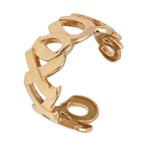 117 - Tiffany & Co. An 18ct gold X 'kiss' bangle, designed by Paloma Picasso, 54mm (internal), maker's... 