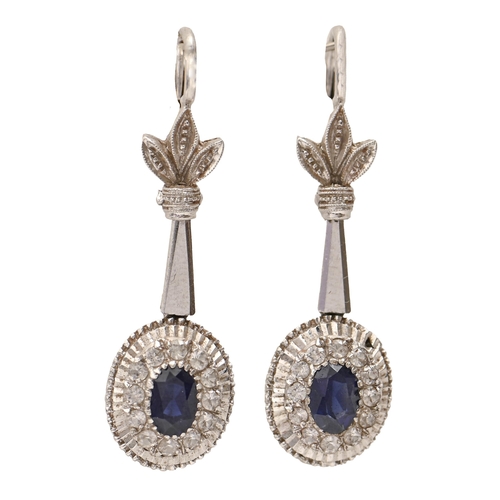 123 - A pair of sapphire and diamond earrings, the oval cluster with single larger central oval sapphire, ... 