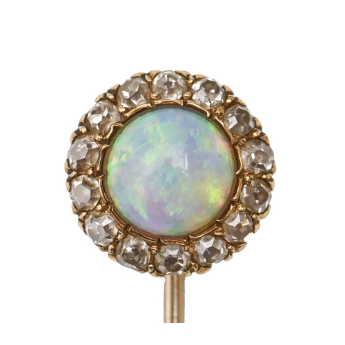 131 - A gold stickpin, the round terminal with opal in a surround of chip diamonds, head 13mm diam, 3.2g... 