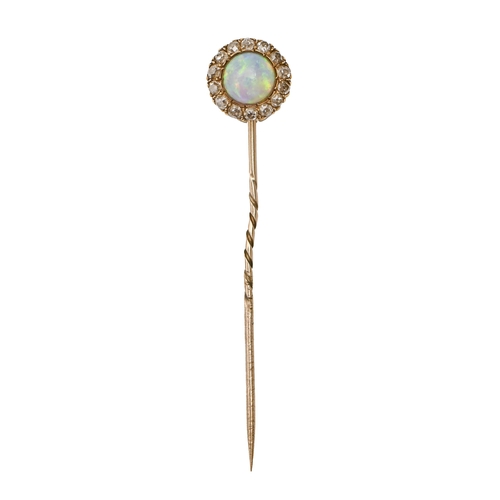 131 - A gold stickpin, the round terminal with opal in a surround of chip diamonds, head 13mm diam, 3.2g... 