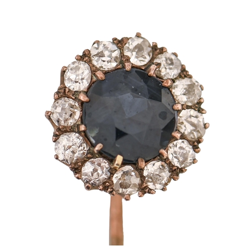 137 - A gold stickpin, the round terminal with sapphire in a surround of chip diamonds, head 12mm diam, 2.... 