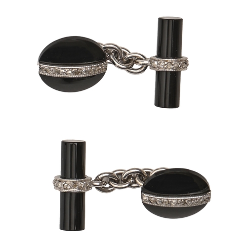 144 - A pair of diamond and black onyx cuff links in art deco style, in 18ct white gold, 14mm diam, B... 