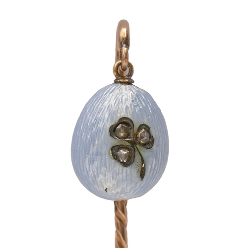 167 - A Russian gold stickpin, c1900, with diamond set gold and blue guilloche enamel egg terminal, 66mm o... 