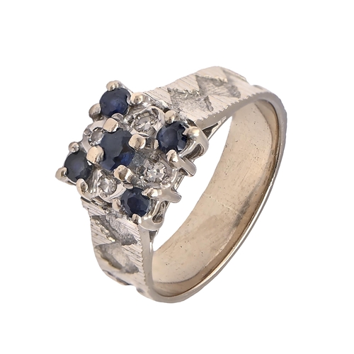 17 - A sapphire and diamond ring, in 18ct white gold, textured hoop, Birmingham 1970, 5g, size J... 