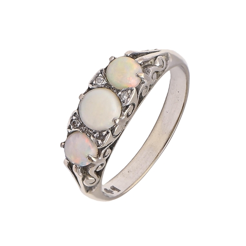 19 - An opal ring with diamond accents, in white gold, marked 9ct, 2.6g, size L