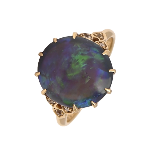 22 - A black opal and diamond ring, in gold, marked 18ct and stamped with an inventory number, 4.4g, size... 