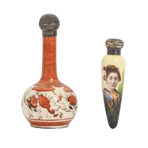 246 - An Edwardian silver capped porcelain scent bottle, printed and painted with a Japanese girl, 76mm l,... 