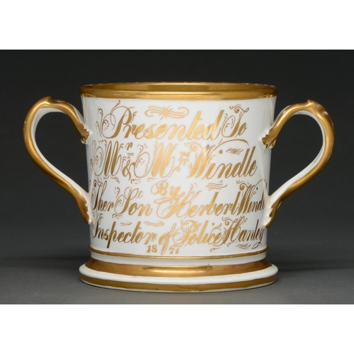 395 - An English porcelain loving cup, dated 1871, painted with flowers and inscribed Presented to Mr and ... 